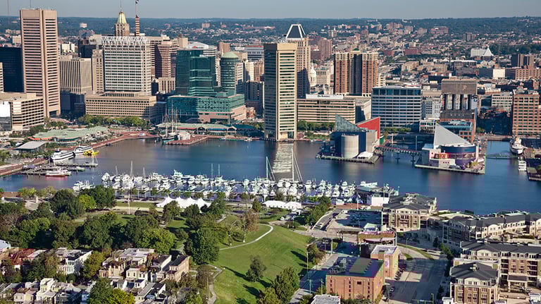 Baltimore's stunning Inner Harbor skyline shines under clear skies, showcasing the vibrant heart of the city; Photo courtesy of Visit Baltimore