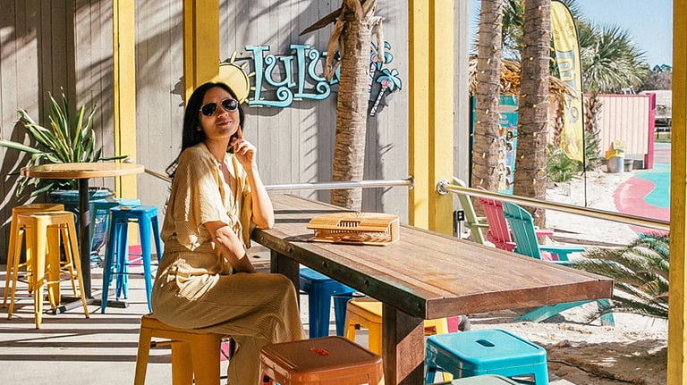 Bright colors, coastal vibes, and al fresco dining make LuLu’s in Destin the perfect spot to unwind by Choctawhatchee Bay; Photo courtesy of VISIT FLORIDA