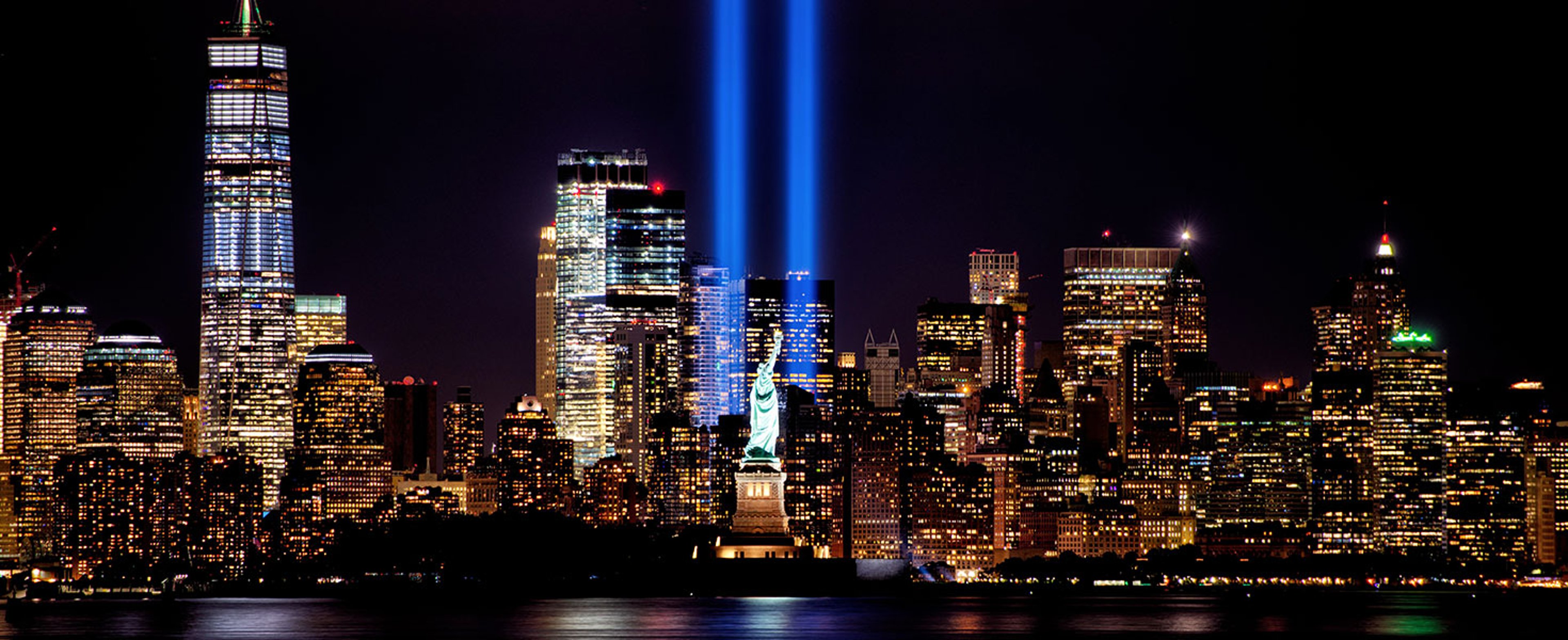 9/11 Memorial Beams with Statue of Liberty and Lower Manhattan. By Brian E Kushner