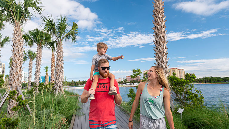 A family strolls the St. Pete Pier boardwalk; photo courtesy of Visit St. Pete/Clearwater