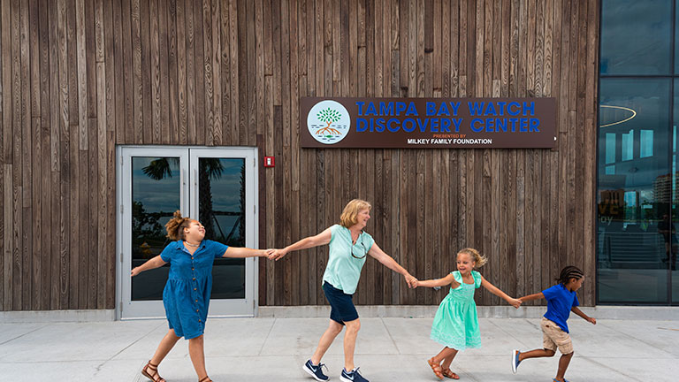 Families exploring the Tampa Bay Watch Discovery Center; photo courtesy of Visit St. Pete/Clearwater