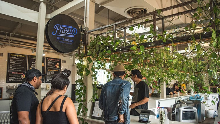 Guests ordering drinks inside Presta Coffee Roasters in Tucson, Arizona
