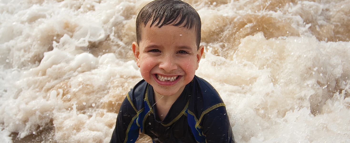 Boy in ocean in Hawaii