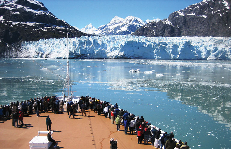 People on cruise look at Glacier Bay National Park