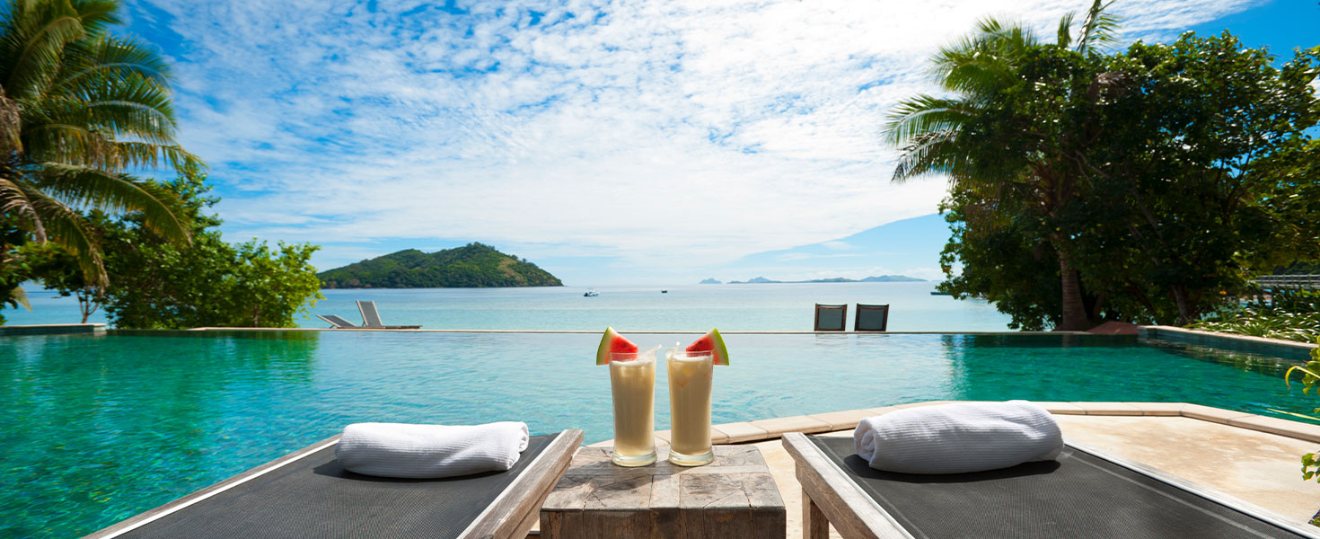 Chairs in front of water in Bora Bora