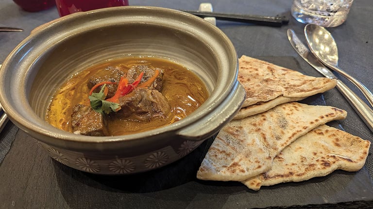 The Riviera’s Red Ginger restaurant serves up bold Asian cuisine such as this Malaysian beef panang; photo by Andrea M. Corbin