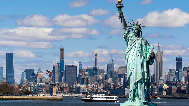 The Statue of Liberty over the Scene of New york cityscape river side which location is lower manhattan,Architecture and building with tourist concept, photo By THANANIT