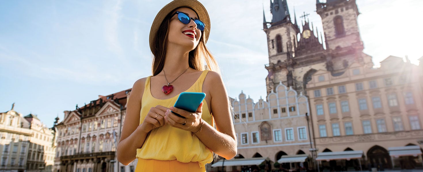 Woman traveling with phone out