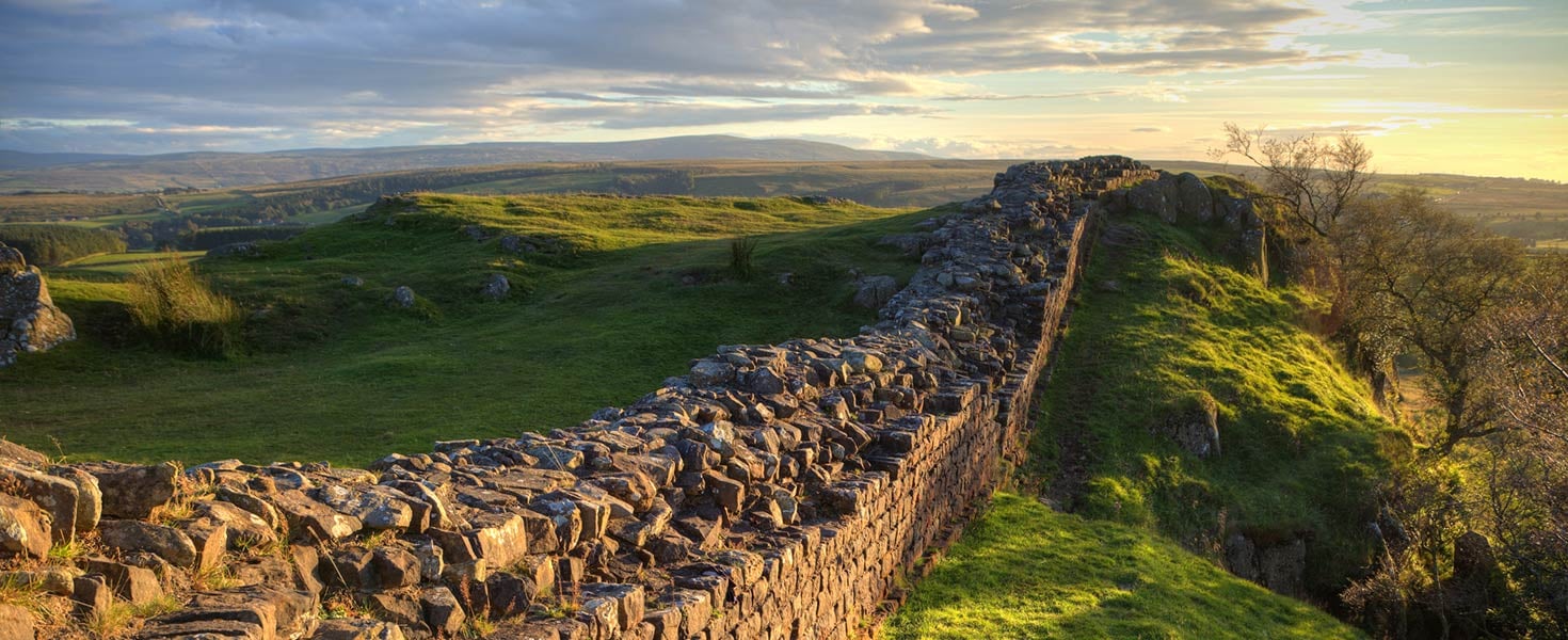 A stretch of Hadrian's Wall at Walton's Crags in Northumberland, England, coloured by the setting sun