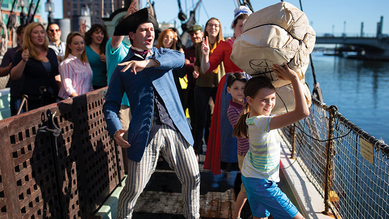 Visitors participate in the ‘Destruction of the Tea’ at the Boston Tea Party Ships & Museum; photo by Michael Blanchard Photography/Boston Tea Party Ships & Museum