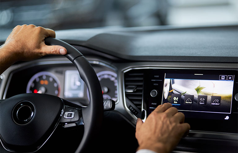 man using car dashboard screen