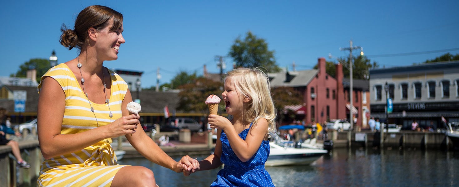 Woman and child enjoying ice cream at City Dock in Annapolis, Maryland