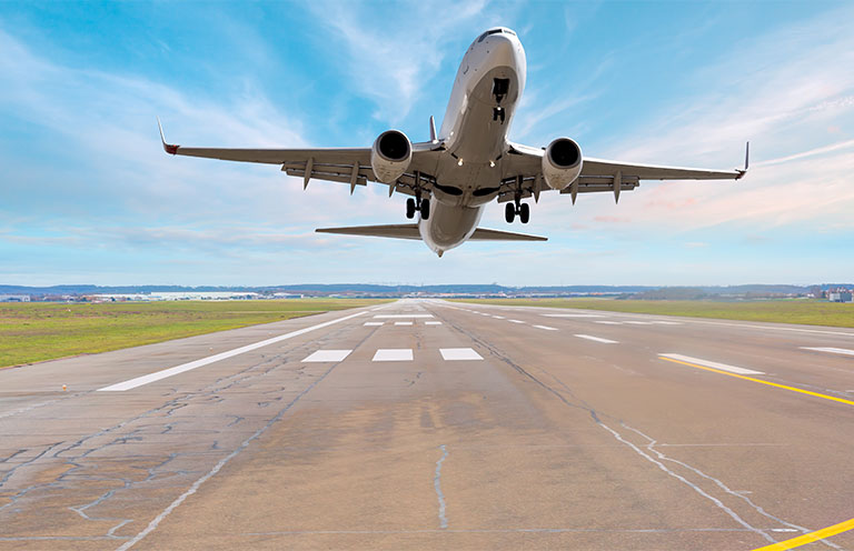 plane taking off on runway