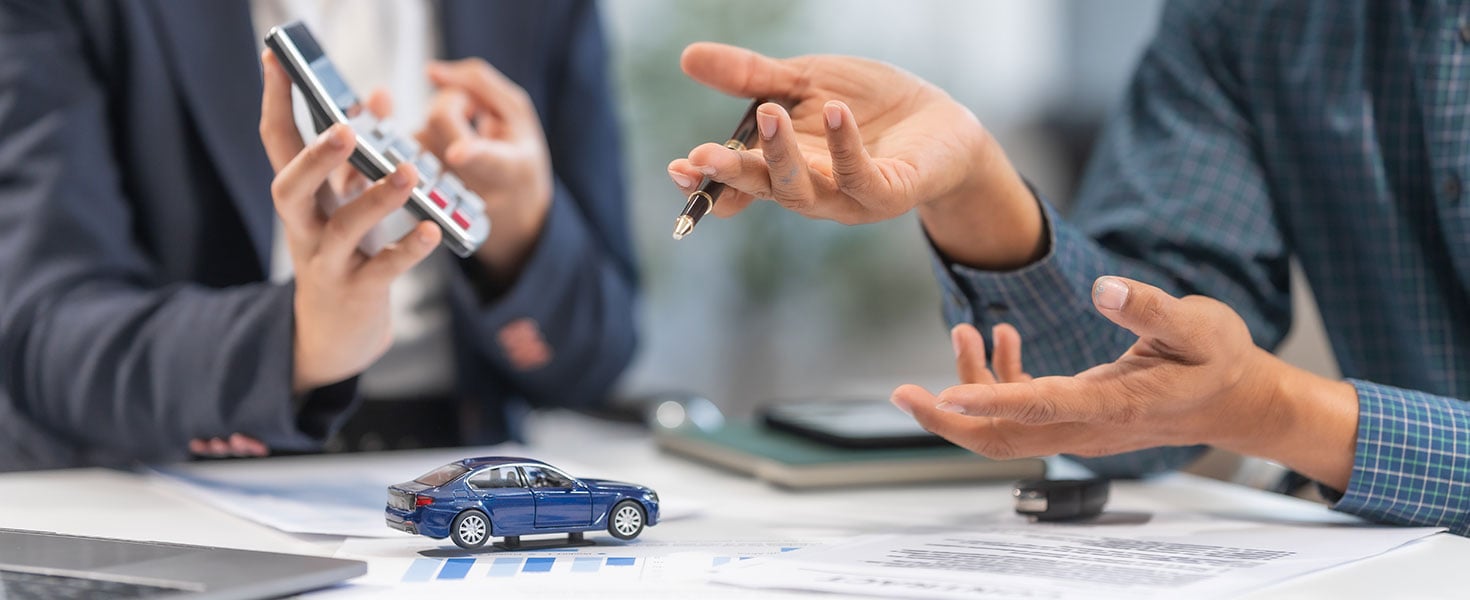 Asian businesswoman specializing in car loan services. Proficient in terms like extended warranty, lease, MSRP, and navigating financing options for customers' automotive needs; by Phushutter