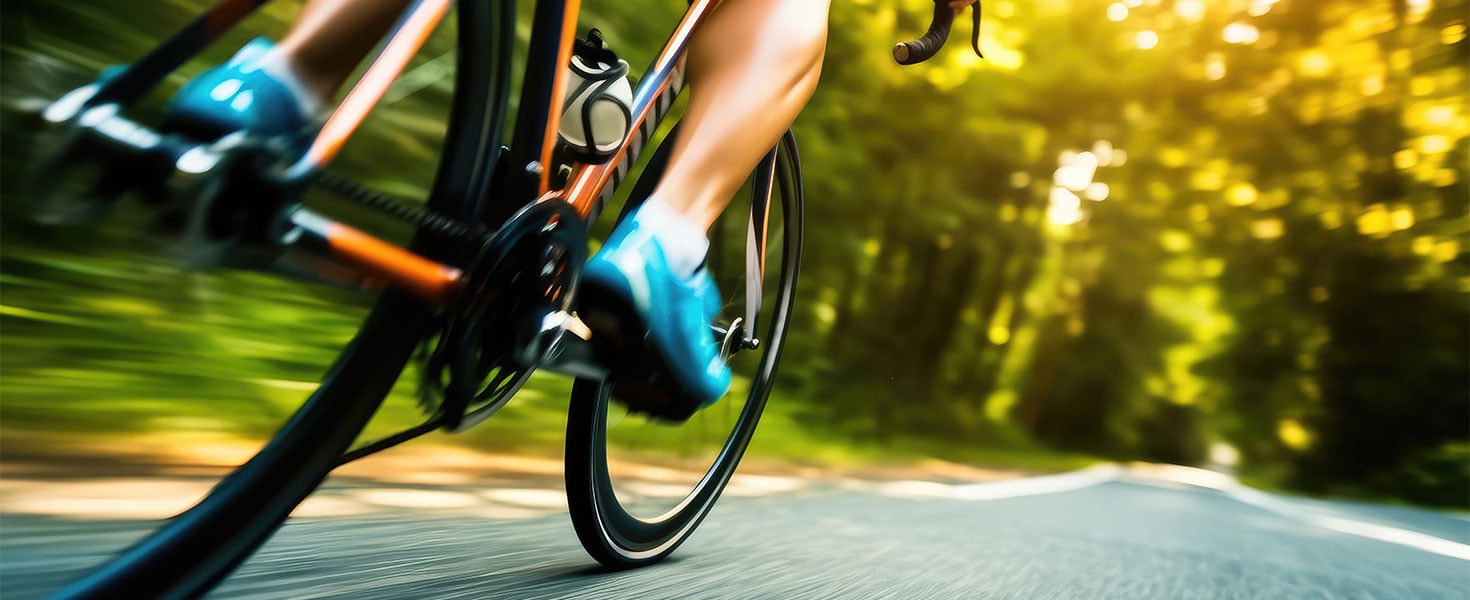 close up of person riding bicycle