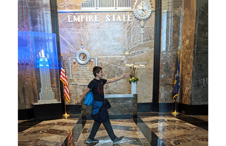 boy inside the empire state building