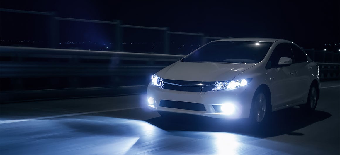 car with it's head lights on