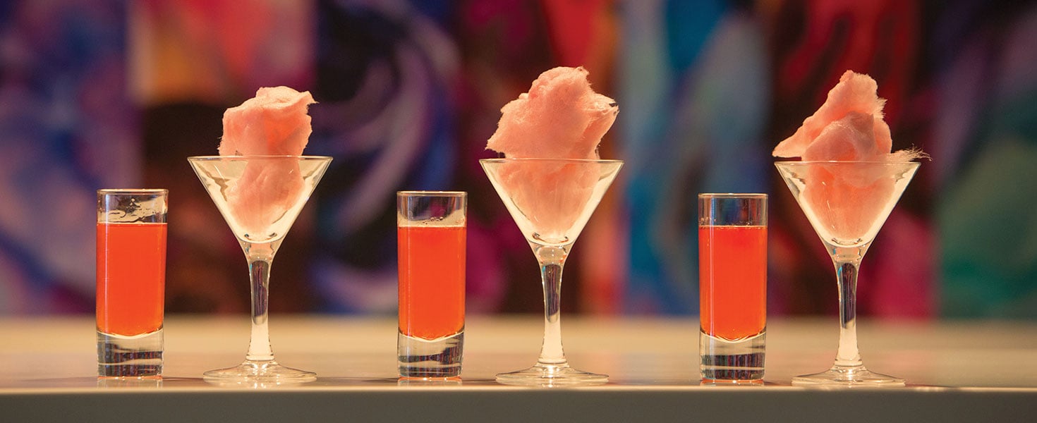 Cotton candy cosmos and shots at Royal Caribbean’s Wonderland restaurant. Photo courtesy of Royal Caribbean