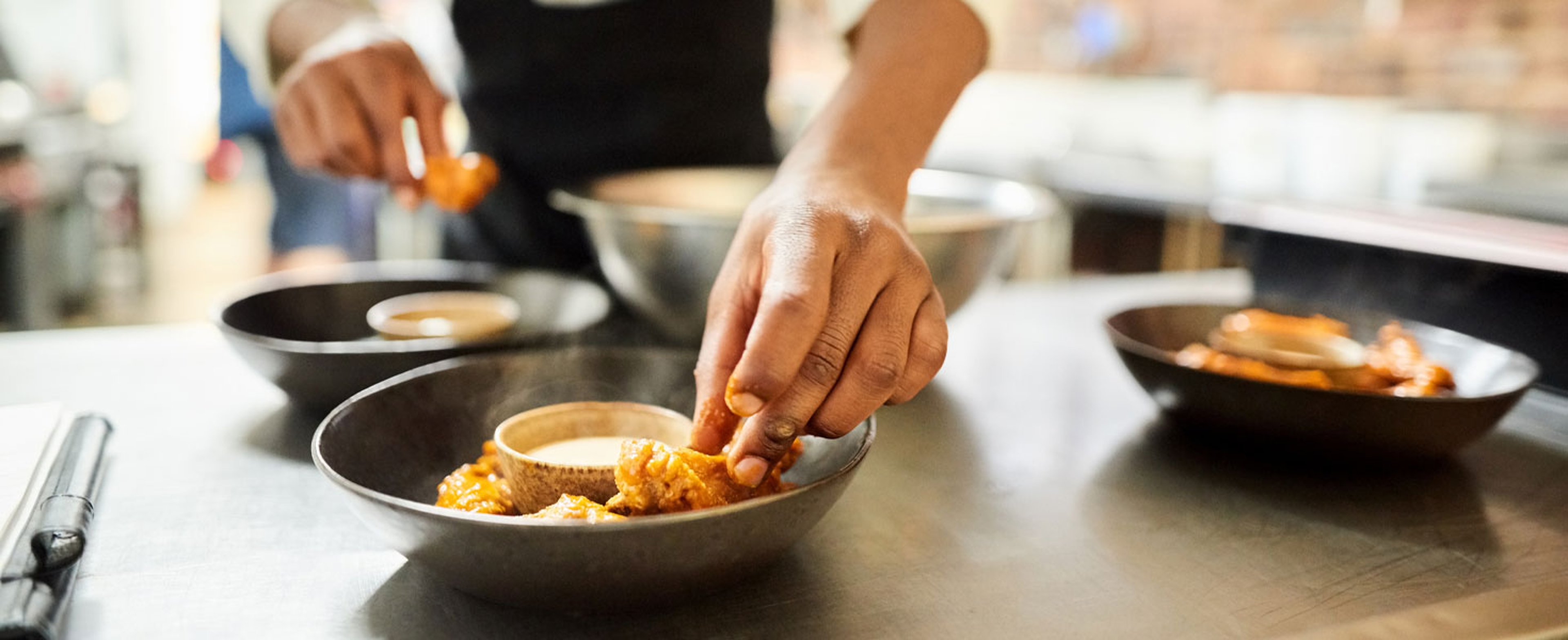 Chef in kitchen prepping food