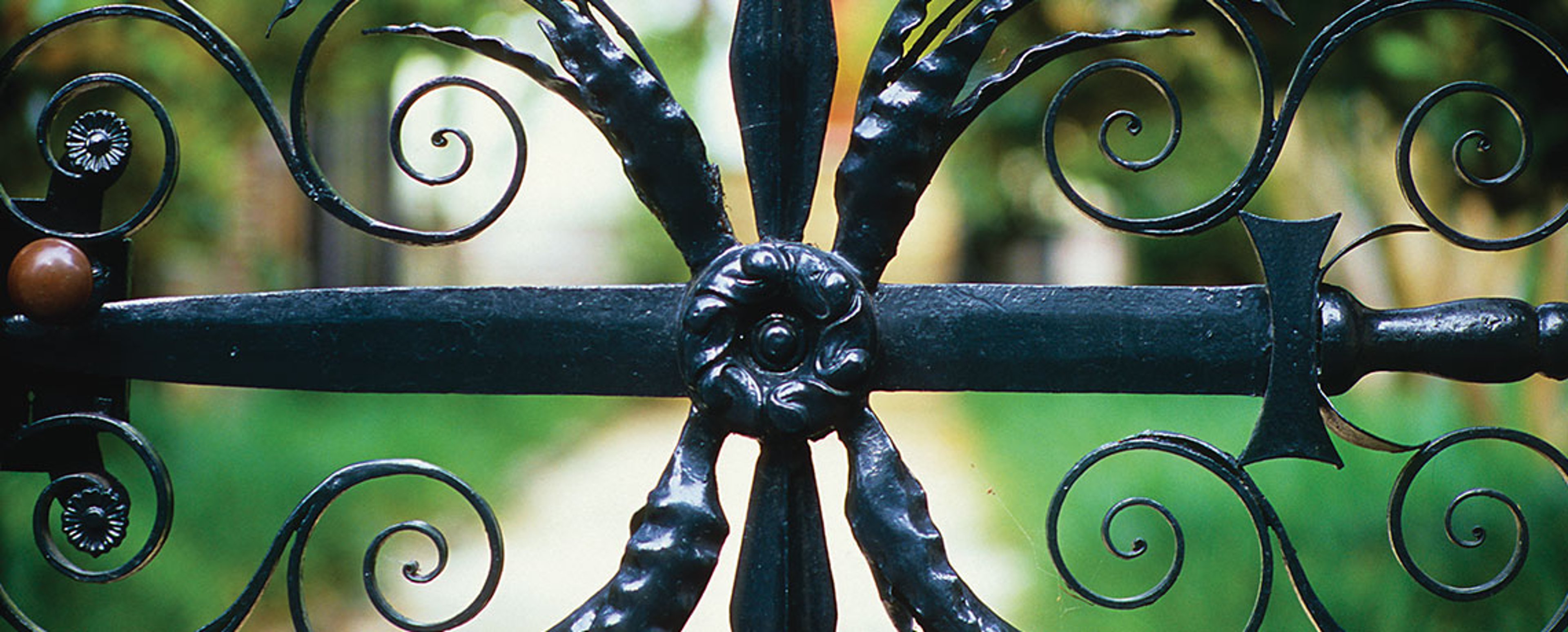 Charleston’s ornamental wrought-iron gates offer glimpses into the city’s lovely gardens. Photo courtesy of Explore Charleston