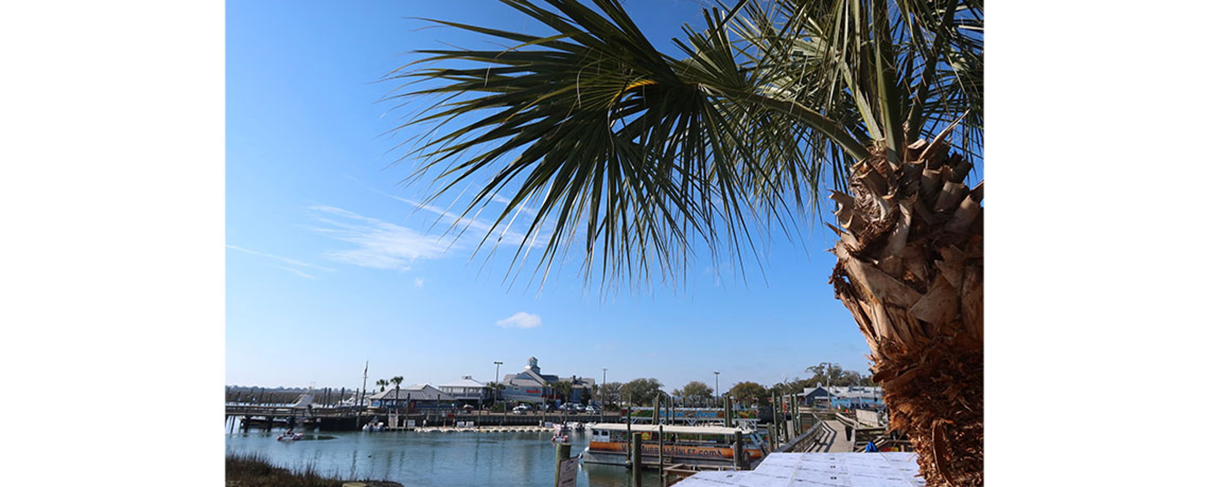 The MarshWalk in Murrells Inlet is lined with casual restaurants serving up some of the best seafood in South Carolina. Photo by Angelina Tillilie