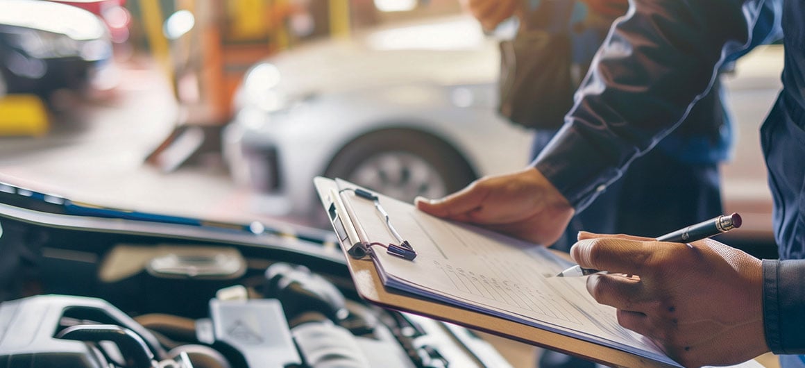 Auto check, car service shop concept. Automobile repairman writing job checklist on clipboard, mechanic checking engine to estimate repair machine, inspecting maintenance by engineer at vehicle garage; by Svetlana