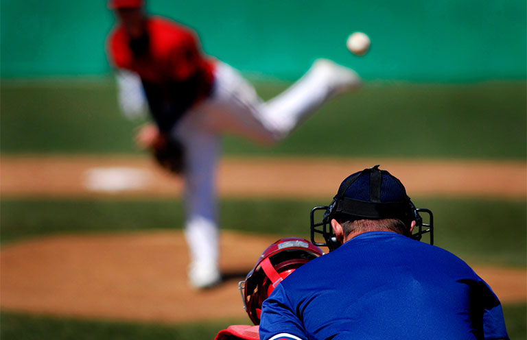 pitcher and catcher playing baseball