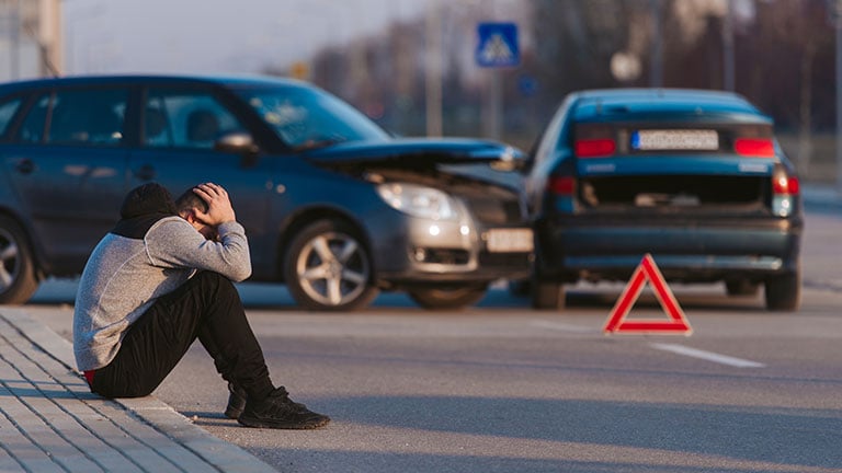 Sad man after car accident by qunica.com