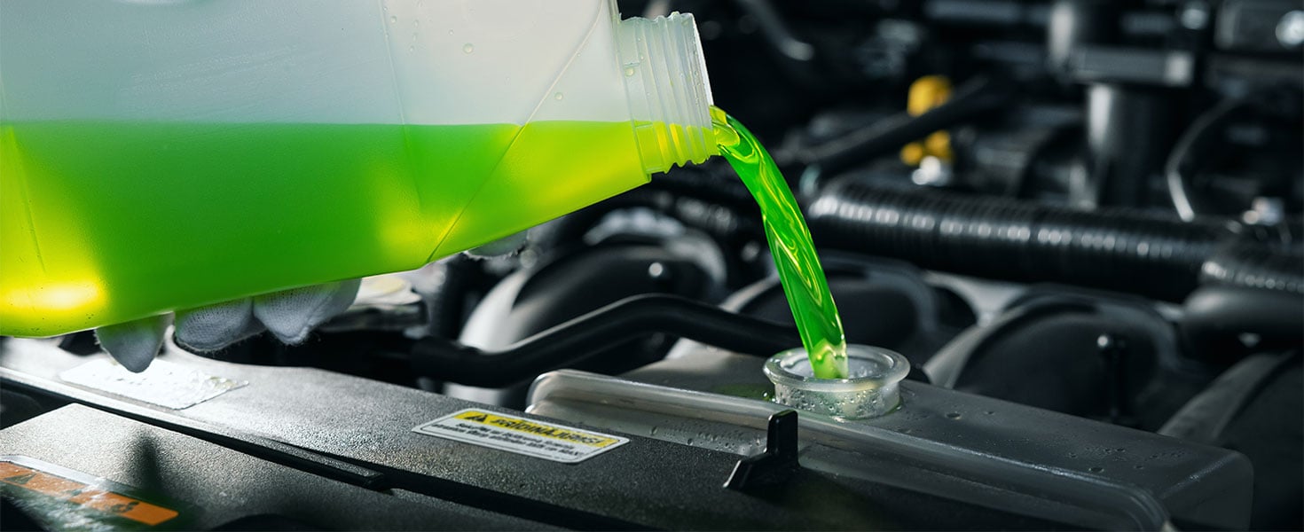 antifreeze being poured into reservoir