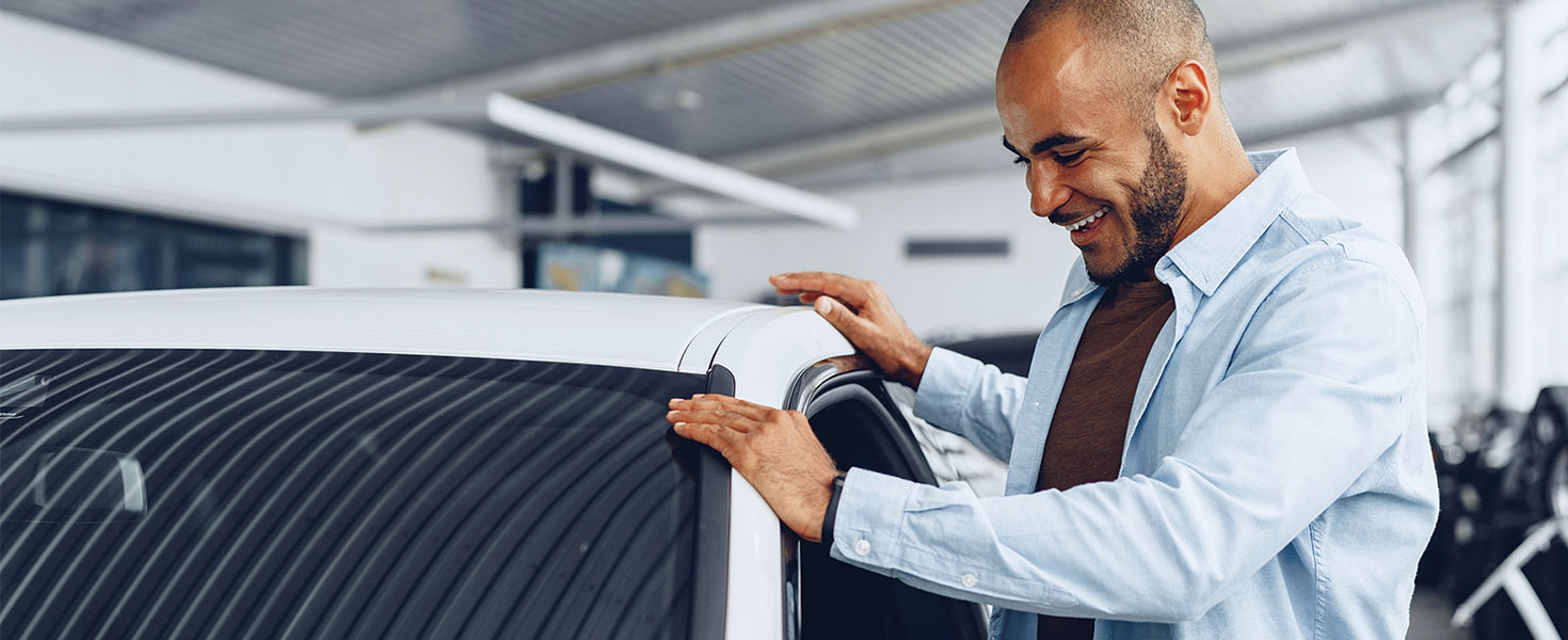 Man looking at new car