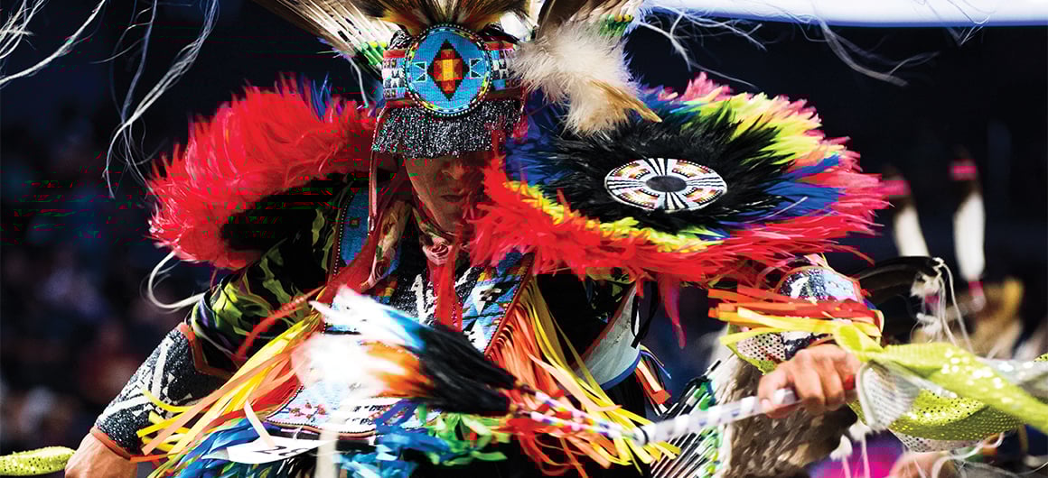 Man in traditional powwow attire