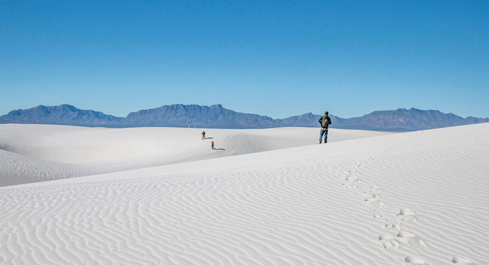 Walking in the sand. Photo courtesy of NPS
