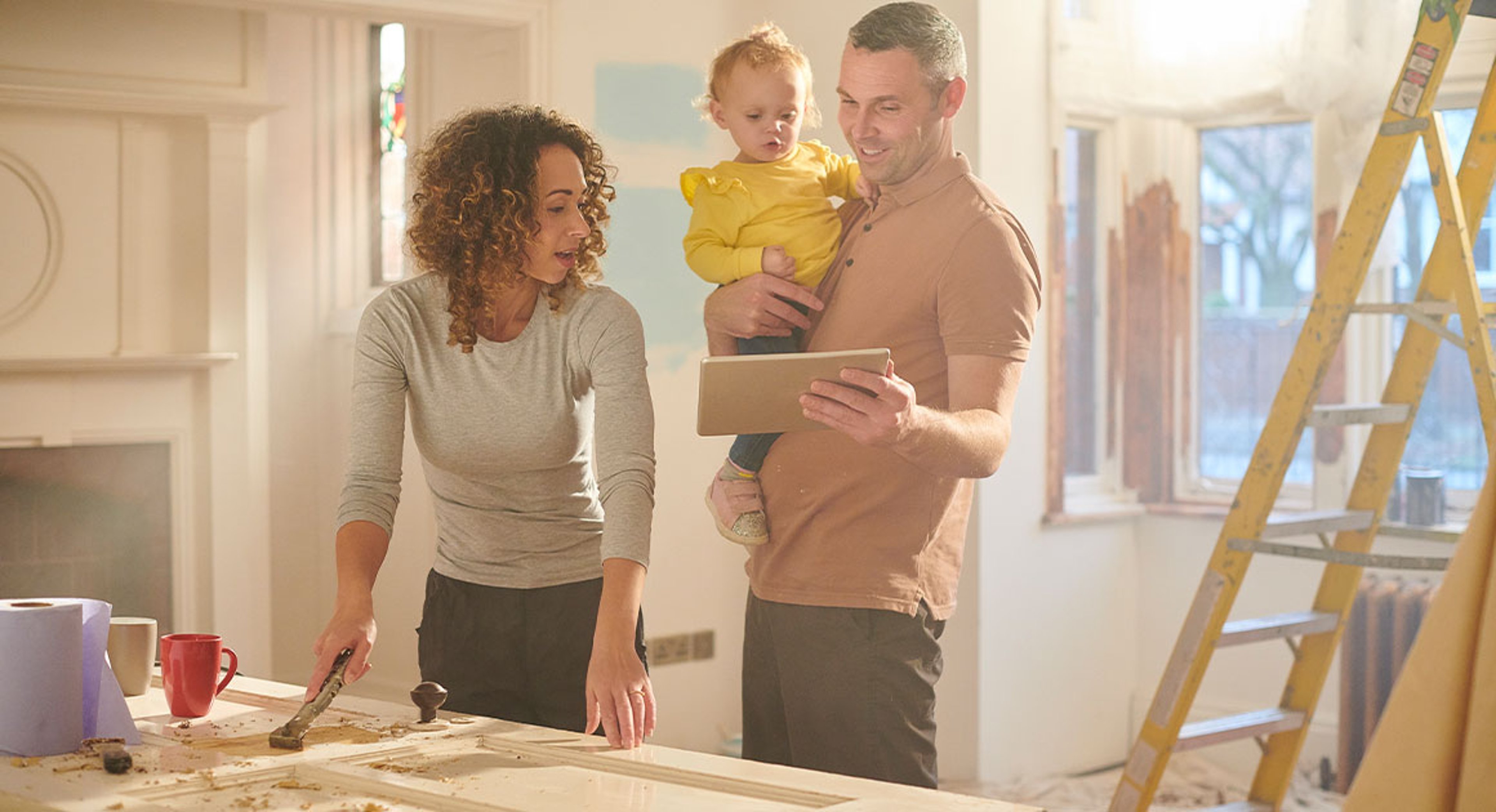 young diy family getting good news by tablet