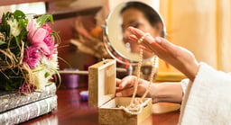 woman looking at jewelry