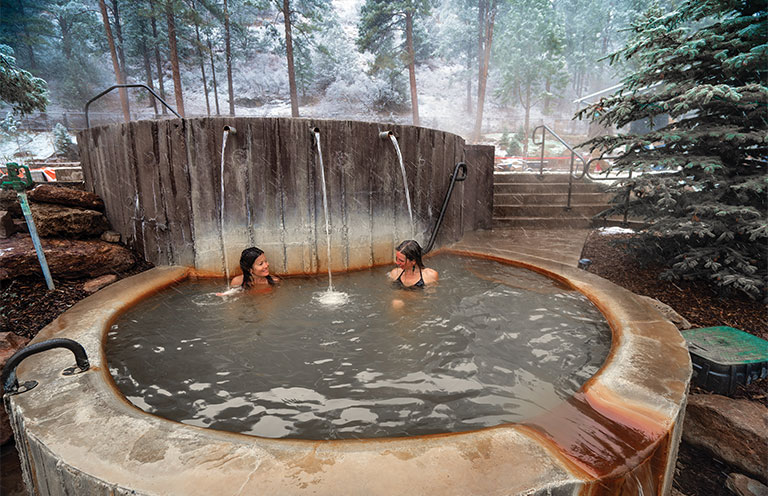 people soaking in hot spring outdoor