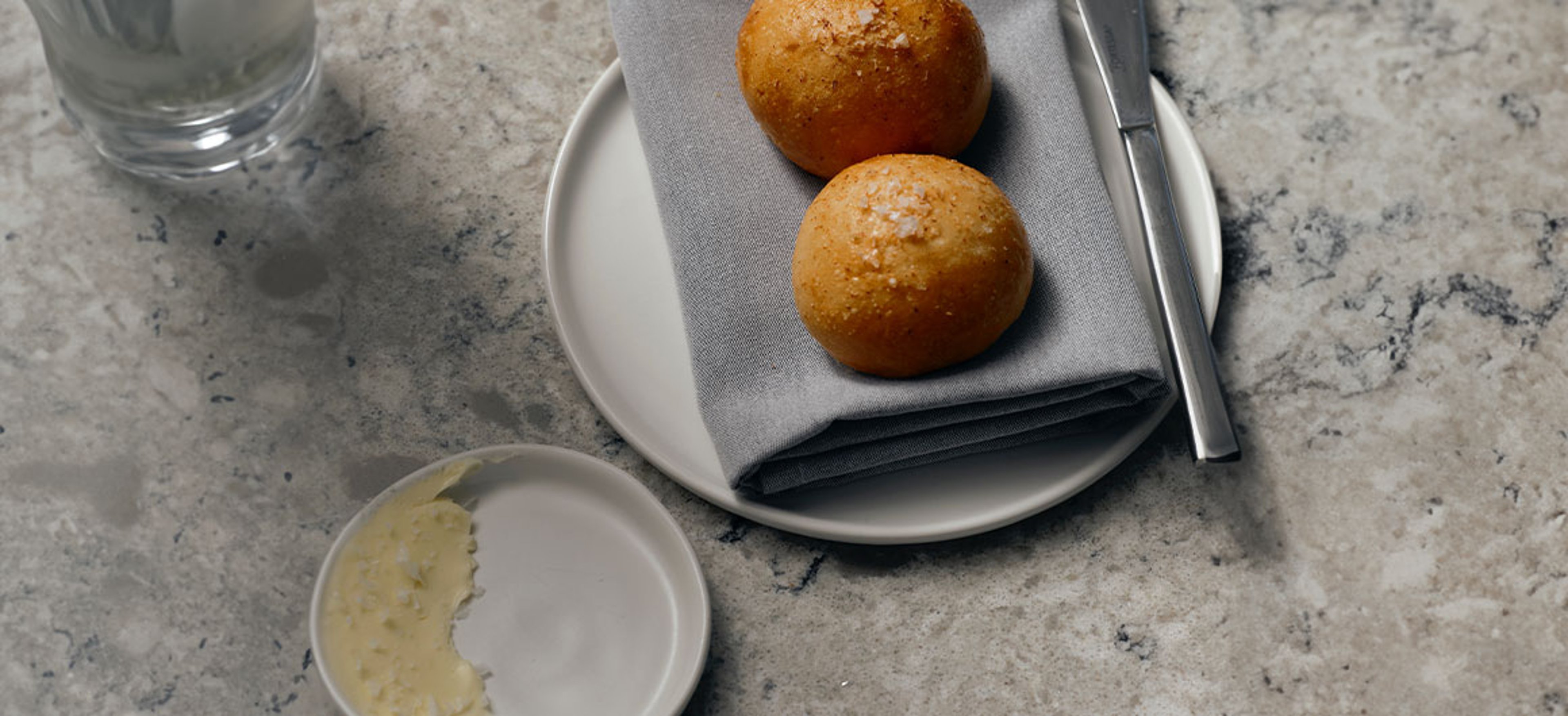 honey butter and bread on plate