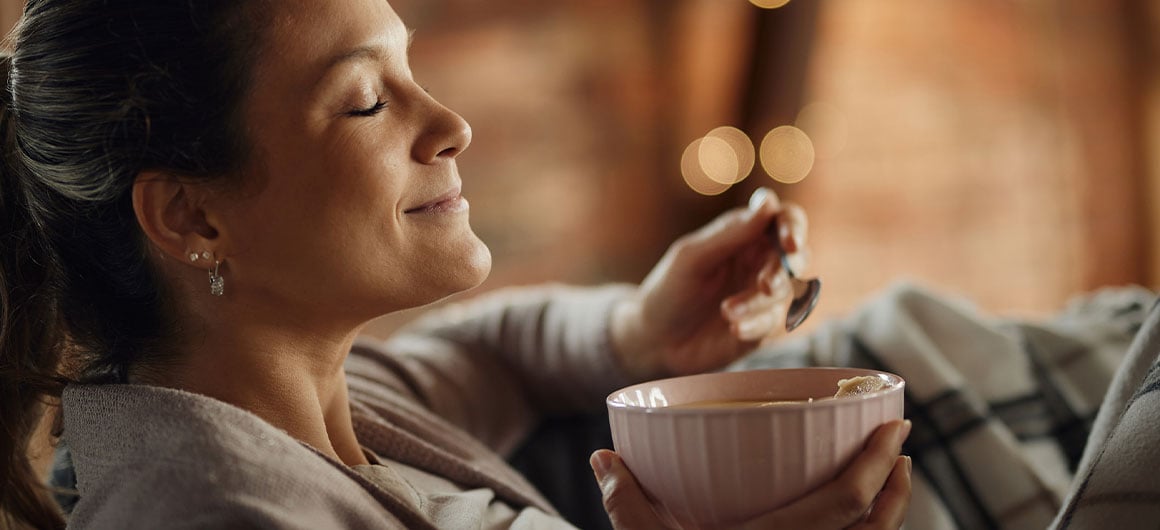 woman eating soup