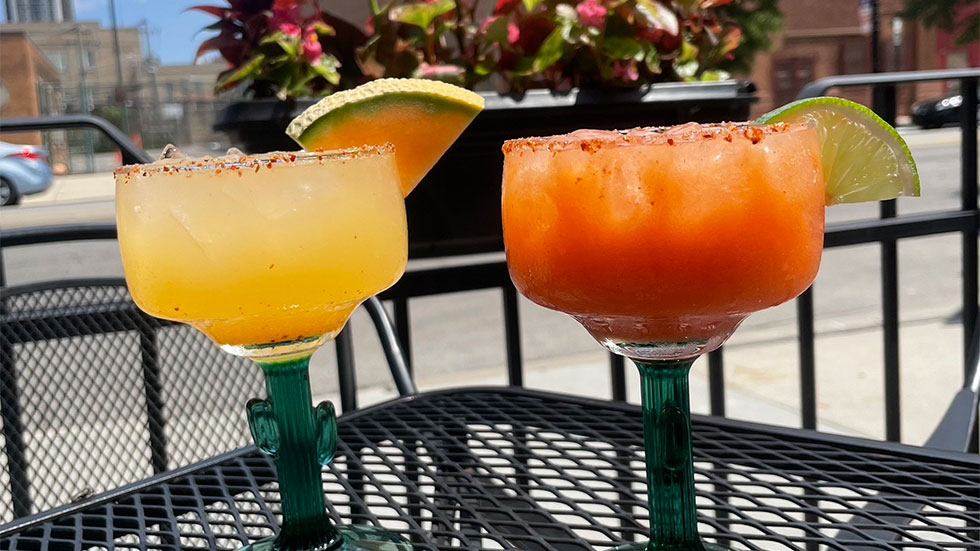 margaritas and guacamole on table