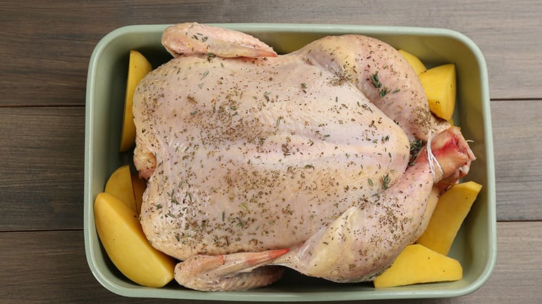 Roasting Turkey in the Oven for Holiday Dinner. Credit: GMVozd