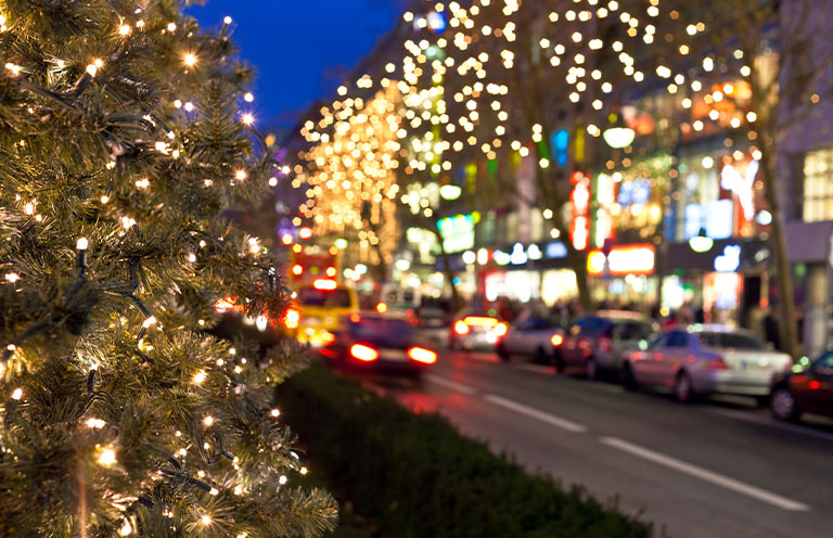 cars on holiday decorated street