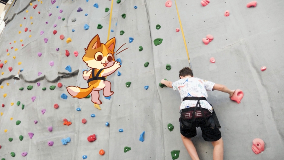 KeeKee climbing rock wall aboard a cruise