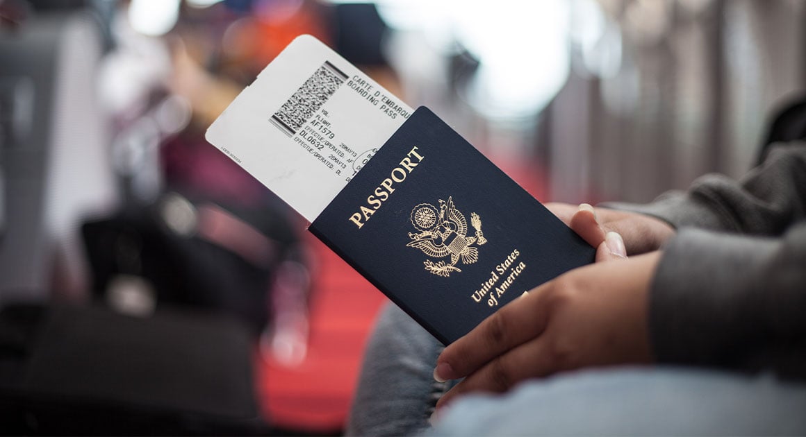person holding USA passport