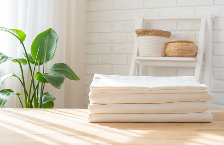 sheets folded on table