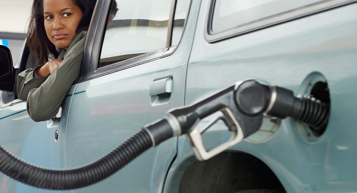 woman getting gas