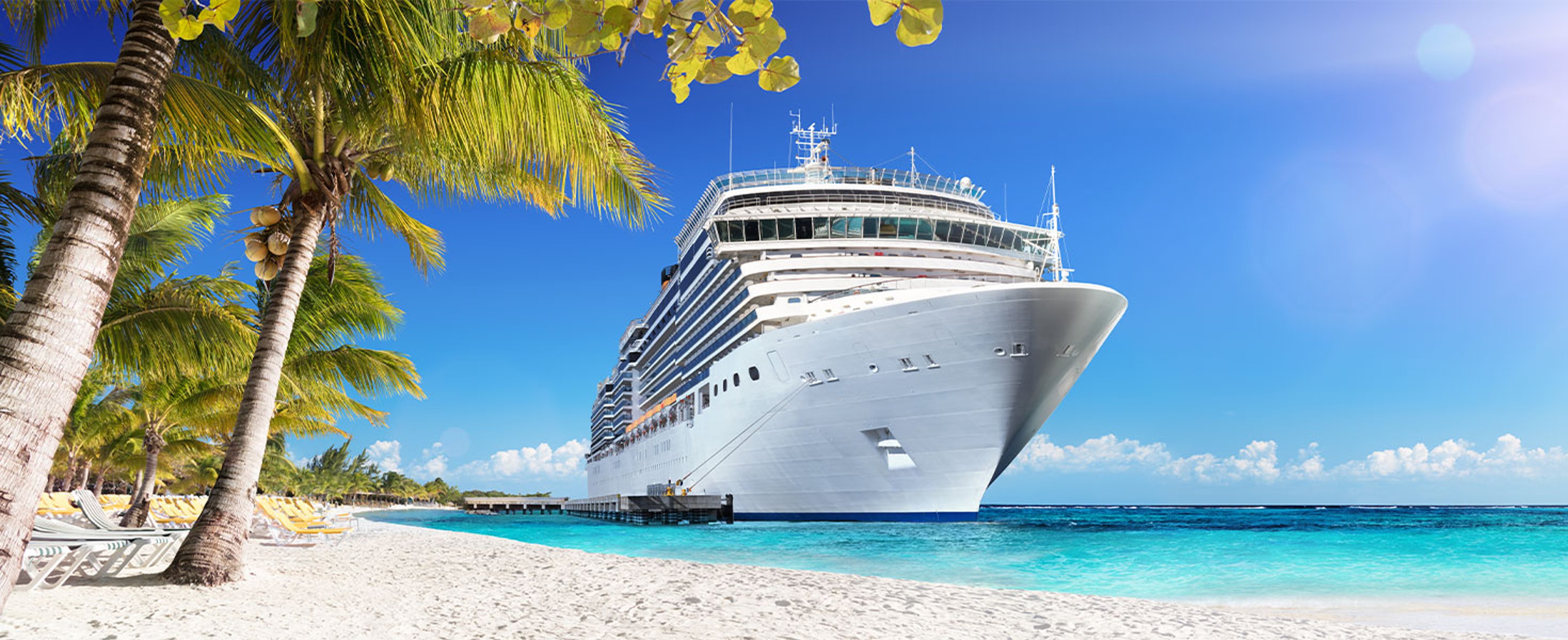 Cruise ship seen from a tropical beach