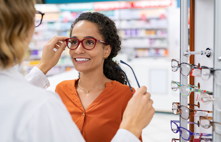 woman trying on glasses