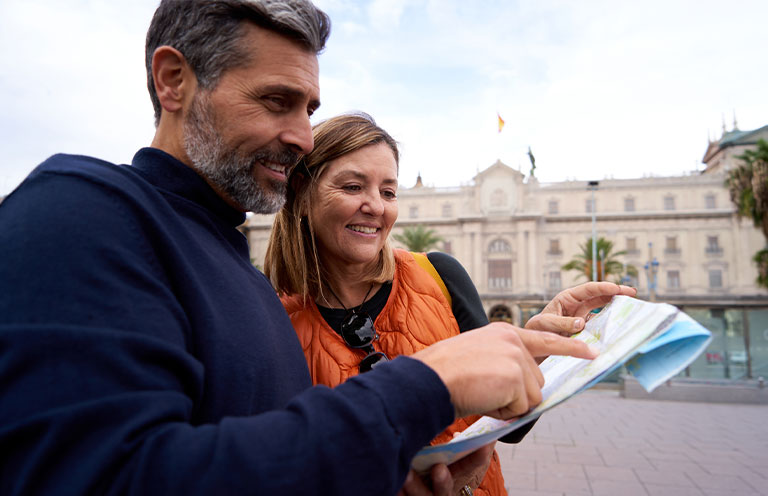 man and woman looking at map