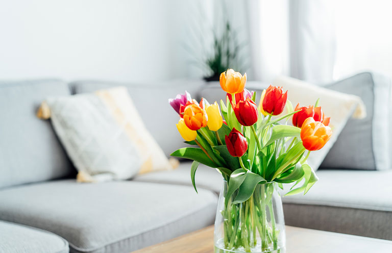 flowers in. a vase on a center table