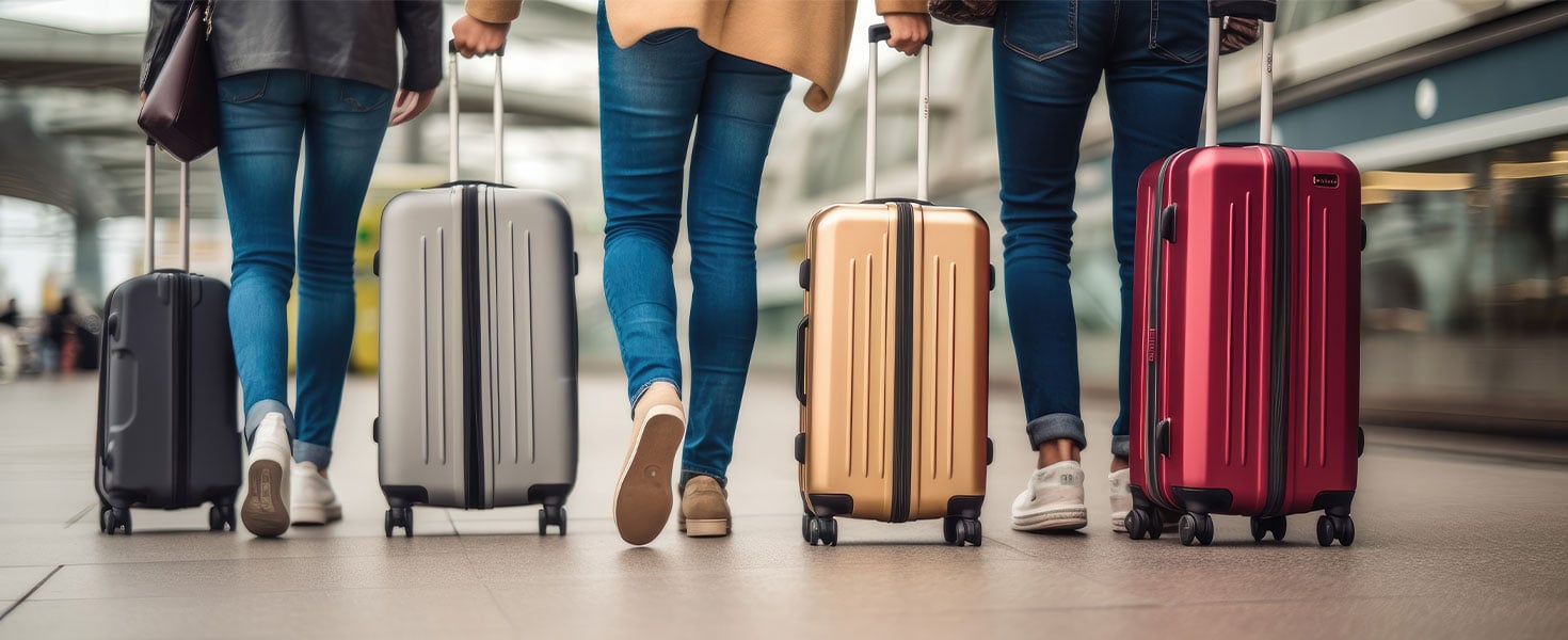 people walking with suitcases