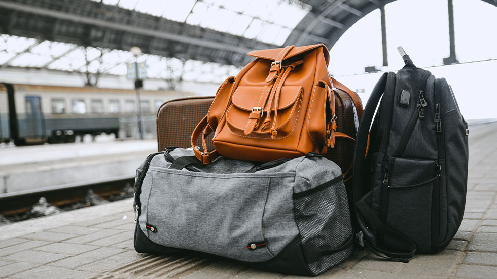 variety of luggage at train station
